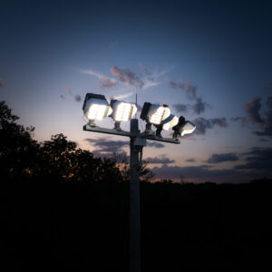 Multiple KSL2 STRATOS mini fixtures atop a spun concrete pole. This project is at the North London Athletic Fields in London.